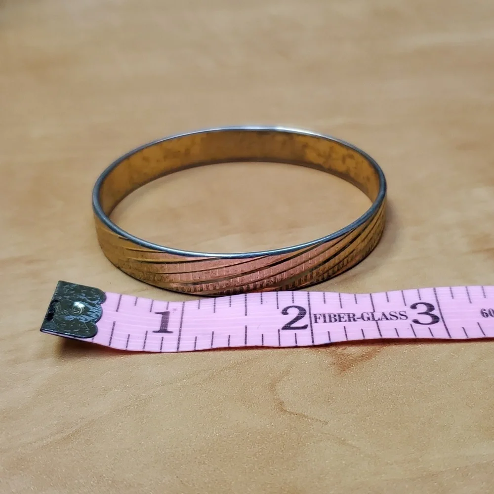Solid metal gold colored costume bracelet